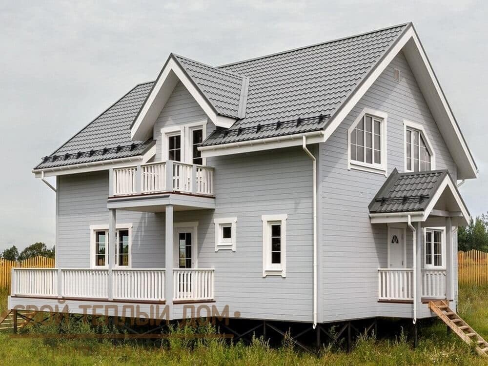 Каркасный дом с окрашенной имитацией бруса